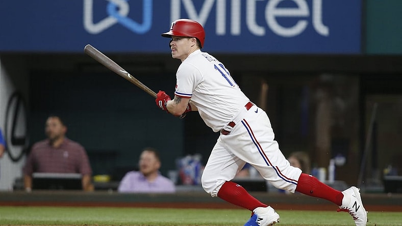 Jun 9, 2021; Arlington, Texas, USA; Texas Rangers third baseman Brock Holt (16) drives in the winning run in the eleventh inning with a single against the San Francisco Giants at Globe Life Field. Mandatory Credit: Tim Heitman-USA TODAY Sports