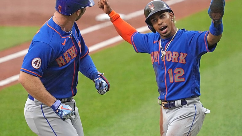 Jun 9, 2021; Baltimore, Maryland, USA; New York Mets first baseman Pete Alonso (20) is greeted by shortstop Francisco Lindor (12) who scored on his two run home run in the first inning against the Baltimore Orioles at Oriole Park at Camden Yards. Mandatory Credit: Mitch Stringer-USA TODAY Sports