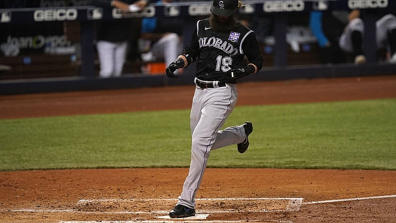 Jun 9, 2021; Miami, Florida, USA; Colorado Rockies right fielder Charlie Blackmon (19) scores a run in the 3rd inning against the Miami Marlins at loanDepot park. Mandatory Credit: Jasen Vinlove-USA TODAY Sports