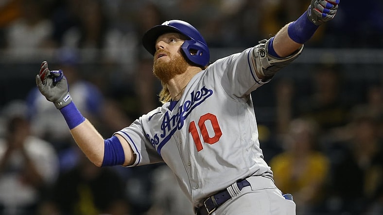 Jun 9, 2021; Pittsburgh, Pennsylvania, USA;  Los Angeles Dodgers third baseman Justin Turner (10) watches his second solo home run of the game clear the fence against the Pittsburgh Pirates during the third inning at PNC Park. Mandatory Credit: Charles LeClaire-USA TODAY Sports