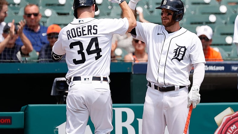 Jun 10, 2021; Detroit, Michigan, USA;  Detroit Tigers catcher Jake Rogers (34) receives congratulations from left fielder Robbie Grossman (8) after he hits a home run in the second inning against the Seattle Mariners at Comerica Park. Mandatory Credit: Rick Osentoski-USA TODAY Sports