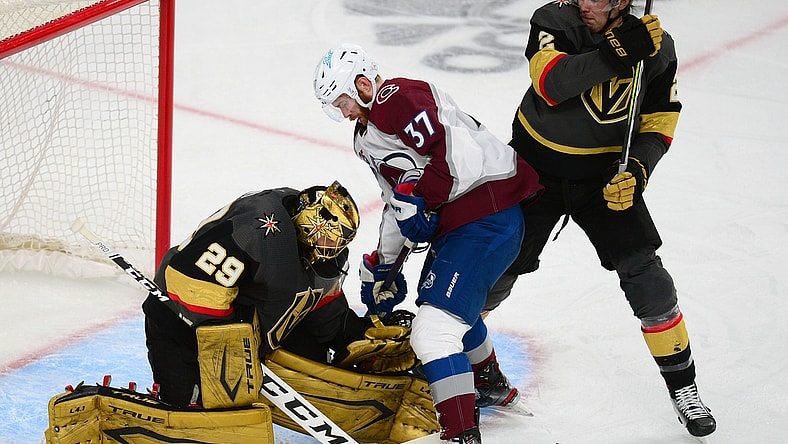 Jun 10, 2021; Las Vegas, Nevada, USA; Vegas Golden Knights goaltender Marc-Andre Fleury (29) defends the goal against Colorado Avalanche left wing J.T. Compher (37) as defenseman Zach Whitecloud (2) helps defend during the second period in game six of the second round of the 2021 Stanley Cup Playoffs at T-Mobile Arena. Mandatory Credit: Gary A. Vasquez-USA TODAY Sports