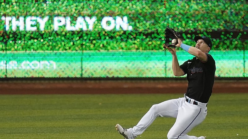 Jun 11, 2021; Miami, Florida, USA; Miami Marlins left fielder Corey Dickerson (23) catches the fly ball of Atlanta Braves shortstop Dansby Swanson (not pictured) in the 3rd inning at loanDepot park. Mandatory Credit: Jasen Vinlove-USA TODAY Sports