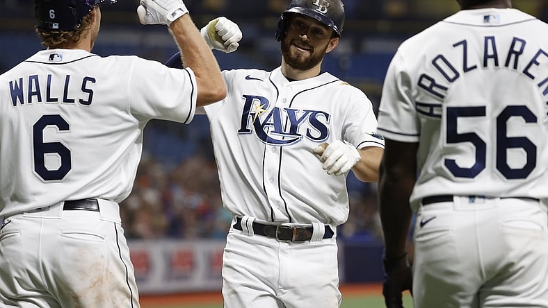 Jun 11, 2021; St. Petersburg, Florida, USA; Tampa Bay Rays second baseman Brandon Lowe (8) is congratulated after scoring a run during the fourth inning against the Baltimore Orioles at Tropicana Field. Mandatory Credit: Kim Klement-USA TODAY Sports