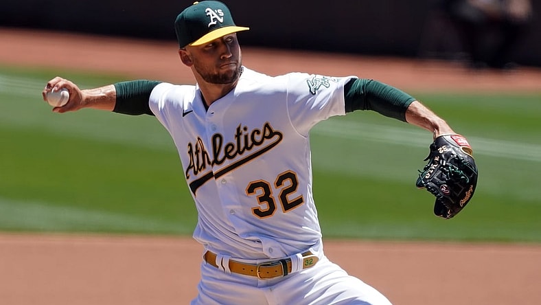 Jun 12, 2021; Oakland, California, USA; Oakland Athletics starting pitcher James Kaprielian (32) throws a pitch during the first inning against the Kansas City Royals at RingCentral Coliseum. Mandatory Credit: Darren Yamashita-USA TODAY Sports