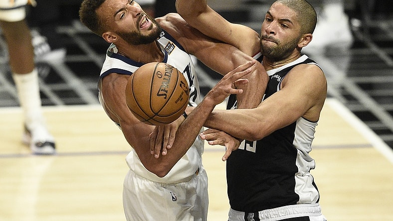 Jun 12, 2021; Los Angeles, California, USA; LA Clippers forward Nicolas Batum (33) fouls Utah Jazz center Rudy Gobert (27) on a shot attempt in the third quarter during game three in the second round of the 2021 NBA Playoffs. at Staples Center. Mandatory Credit: Kelvin Kuo-USA TODAY Sports