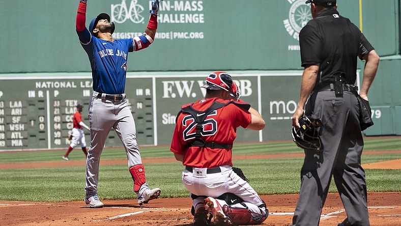 Jun 13, 2021; Boston, Massachusetts, USA; Toronto Blue Jays left fielder Lourdes Gurriel Jr. (13) reacts to hitting a home run as he approaches home plate during the first inning against the Boston Red Sox at Fenway Park. Mandatory Credit: Gregory Fisher-USA TODAY Sports