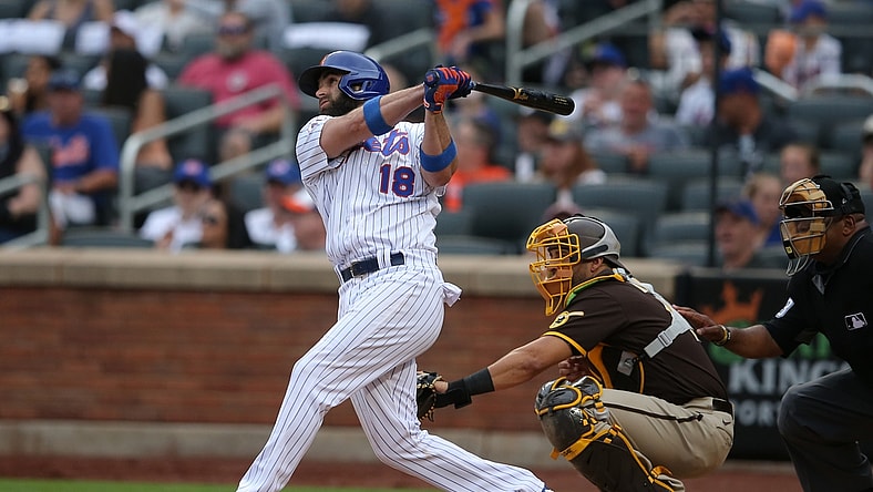 Jun 13, 2021; New York City, New York, USA; New York Mets second baseman Jose Peraza (18) follows through on a two run home run against the San Diego Padres during the fifth inning at Citi Field. Mandatory Credit: Brad Penner-USA TODAY Sports