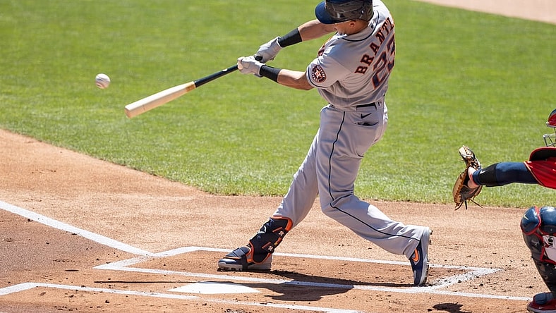 Jun 13, 2021; Minneapolis, Minnesota, USA; Houston Astros designated hitter Michael Brantley (23) hits a double during the first inning against the Minnesota Twins at Target Field. Mandatory Credit: Jordan Johnson-USA TODAY Sports