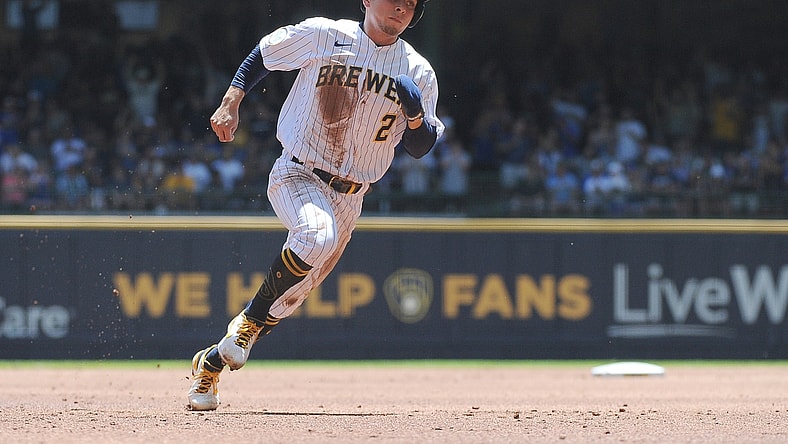 Jun 13, 2021; Milwaukee, Wisconsin, USA; Milwaukee Brewers third baseman Luis Urias (2) rounds second base to score a run against the Pittsburgh Pirates in the first inning at American Family Field. Mandatory Credit: Michael McLoone-USA TODAY Sports
