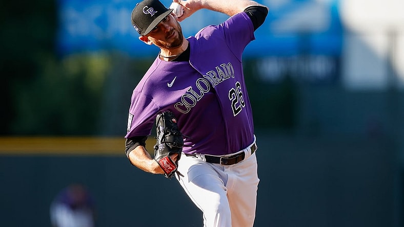 Jun 14, 2021; Denver, Colorado, USA; Colorado Rockies starting pitcher Austin Gomber (26) pitches in the first inning against the San Diego Padres at Coors Field. Mandatory Credit: Isaiah J. Downing-USA TODAY Sports