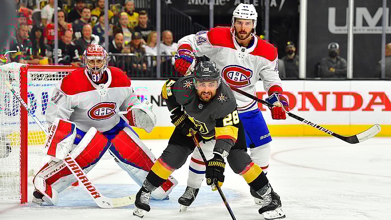 Jun 14, 2021; Las Vegas, Nevada, USA; Montreal Canadiens defenseman Joel Edmundson (44) checks Vegas Golden Knights left wing William Carrier (28) as Montreal Canadiens goaltender Carey Price (31) defends his goal during the first period of game one of the 2021 Stanley Cup Semifinals at T-Mobile Arena. Mandatory Credit: Stephen R. Sylvanie-USA TODAY Sports