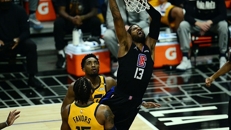 Jun 14, 2021; Los Angeles, California, USA; Los Angeles Clippers guard Paul George (13) scores a basket against the Utah Jazz during the first half in game four in the second round of the 2021 NBA Playoffs. at Staples Center. Mandatory Credit: Gary A. Vasquez-USA TODAY Sports