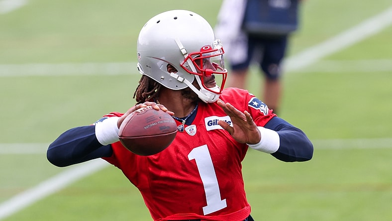 Jun 15, 2021; Foxborough, MA, USA; New England Patriots quarterback Cam Newton (1) participates in a drill during the New England Patriots mini camp at the New England Patriots practice complex. Mandatory Credit: Paul Rutherford-USA TODAY Sports