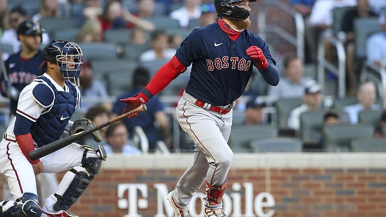 Jun 15, 2021; Atlanta, Georgia, USA; Boston Red Sox center fielder Alex Verdugo (99) hits a single against the Atlanta Braves in the first inning at Truist Park. Mandatory Credit: Brett Davis-USA TODAY Sports