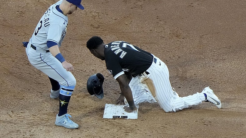 Jun 15, 2021; Chicago, Illinois, USA; Chicago White Sox shortstop Tim Anderson (7) slides safely against Tampa Bay Rays third baseman Mike Brosseau (43) during the third inning at Guaranteed Rate Field. Mandatory Credit: Mike Dinovo-USA TODAY Sports