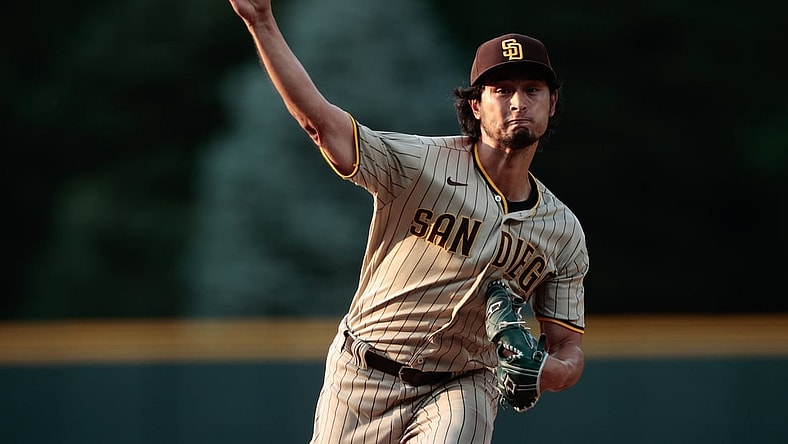Jun 15, 2021; Denver, Colorado, USA; San Diego Padres starting pitcher Yu Darvish (11) pitches in the first inning against the Colorado Rockies at Coors Field. Mandatory Credit: Isaiah J. Downing-USA TODAY Sports