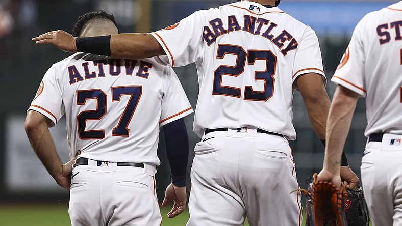 Jun 15, 2021; Houston, Texas, USA; Houston Astros left fielder Michael Brantley (23) talks with second baseman Jose Altuve (27) after a play during the third inning against the Texas Rangers at Minute Maid Park. Mandatory Credit: Troy Taormina-USA TODAY Sports