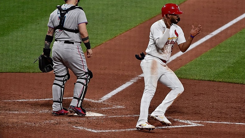 Jun 15, 2021; St. Louis, Missouri, USA;  St. Louis Cardinals pinch hitter Jose Rondon (64) celebrates after scoring the game tying run on a single by first baseman Paul Goldschmidt (not pictured) during the sixth inning against the Miami Marlins at Busch Stadium. Mandatory Credit: Jeff Curry-USA TODAY Sports