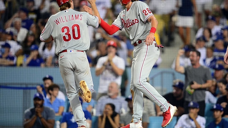 Jun 15, 2021; Los Angeles, California, USA; Philadelphia Phillies third baseman Alec Bohm (28) greets shortstop Luke Williams (30) after both score runs against the Los Angeles Dodgers during the fifth inning at Dodger Stadium. Mandatory Credit: Gary A. Vasquez-USA TODAY Sports