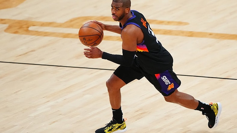 Jun 9, 2021; Phoenix, Arizona, USA; Phoenix Suns guard Chris Paul (3) against the Denver Nuggets during game two in the second round of the 2021 NBA Playoffs at Phoenix Suns Arena. Mandatory Credit: Mark J. Rebilas-USA TODAY Sports
