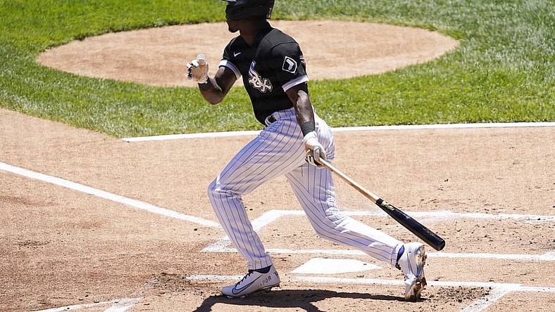 Jun 16, 2021; Chicago, Illinois, USA; Chicago White Sox shortstop Tim Anderson (7) hits a single against the Tampa Bay Rays during the first inning at Guaranteed Rate Field. Mandatory Credit: David Banks-USA TODAY Sports