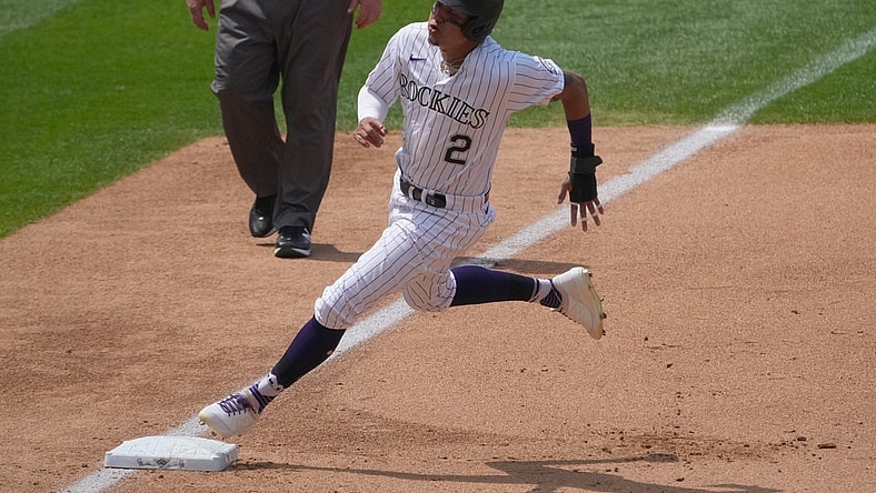 Jun 16, 2021; Denver, Colorado, USA; Colorado Rockies center fielder Yonathan Daza (2) rounds third base on his way to score in the fourth inning against the San Diego Padres at Coors Field. Mandatory Credit: Ron Chenoy-USA TODAY Sports