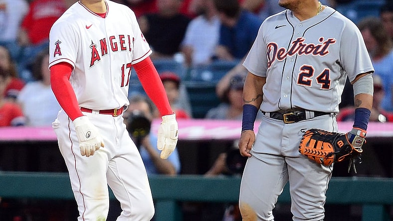Jun 17, 2021; Anaheim, California, USA; Los Angeles Angels starting pitcher Shohei Ohtani (17) speaks with Detroit Tigers first baseman Miguel Cabrera (24) after reaching first on a walk during the fifth inning at Angel Stadium. Mandatory Credit: Gary A. Vasquez-USA TODAY Sports