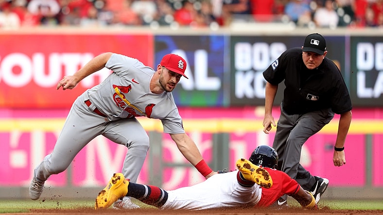 Jun 18, 2021; Atlanta, Georgia, USA; St. Louis Cardinals shortstop Paul DeJong (11) tags out Atlanta Braves outfielder Ronald Acuna Jr. (13) on a stolen base attempt at second base during the first inning at Truist Park. Mandatory Credit: Jason Getz-USA TODAY Sports