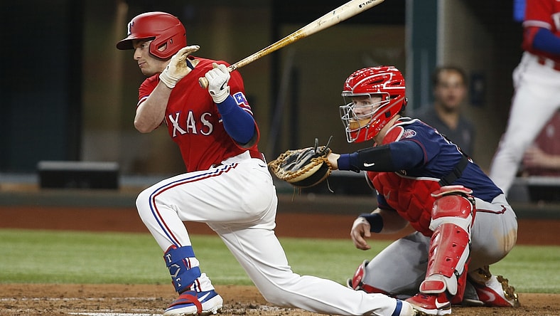 Jun 18, 2021; Arlington, Texas, USA; Texas Rangers second baseman Nick Solak (15) singles in a run in the first inning against the Minnesota Twins at Globe Life Field. Mandatory Credit: Tim Heitman-USA TODAY Sports