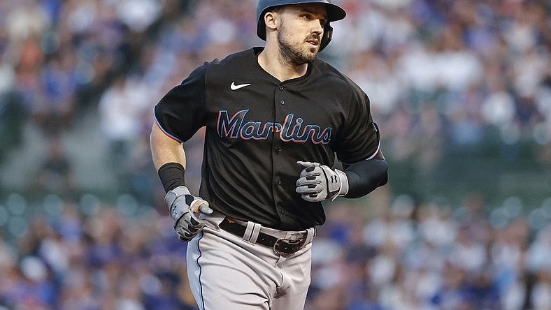 Jun 18, 2021; Chicago, Illinois, USA; Miami Marlins left fielder Adam Duvall (14) rounds the bases after hitting a grand slam off Chicago Cubs starting pitcher Zach Davies (not pictured) during the third inning at Wrigley Field. Mandatory Credit: Kamil Krzaczynski-USA TODAY Sports