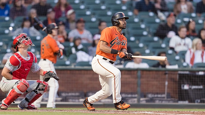 Jun 18, 2021; San Francisco, California, USA; San Francisco Giants left fielder LaMonte Wade Jr (31) hits a RBI triple against the Philadelphia Phillies in the fourth inning at Oracle Park. Mandatory Credit: John Hefti-USA TODAY Sports