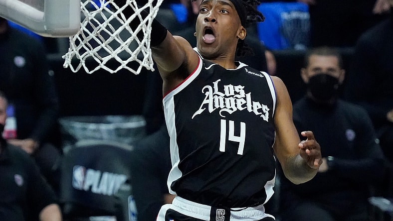 Jun 18, 2021; Los Angeles, California, USA; LA Clippers guard Terance Mann (14) scores on a breakaway during the third quarter of game six in the second round of the 2021 NBA Playoffs against the Utah Jazz at Staples Center. Mandatory Credit: Robert Hanashiro-USA TODAY Sports