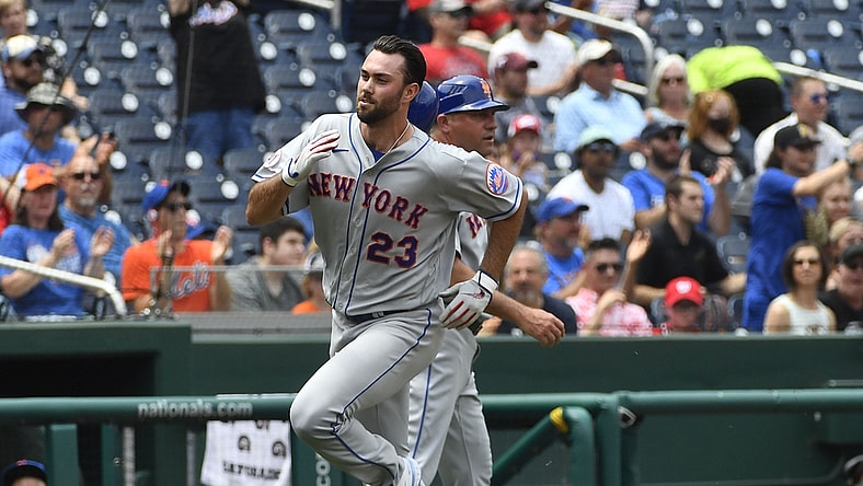 Jun 19, 2021; Washington, District of Columbia, USA; New York Mets starting pitcher David Peterson (23) scores a run against the Washington Nationals during the third inning at Nationals Park. Mandatory Credit: Brad Mills-USA TODAY Sports