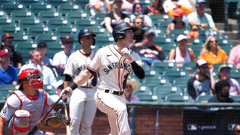 Jun 19, 2021; San Francisco, California, USA; San Francisco Giants left fielder Mike Yastrzemski (5) hits a two-run home run against the Philadelphia Phillies during the first inning at Oracle Park. Mandatory Credit: Kelley L Cox-USA TODAY Sports