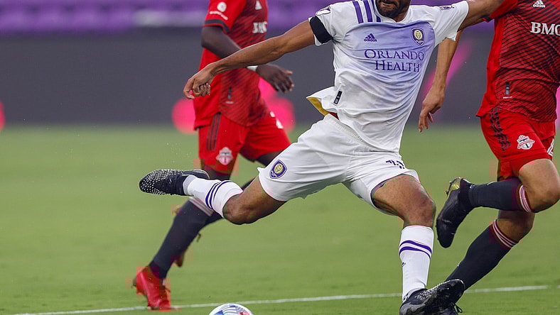 Jun 19, 2021; Orlando, Florida, CAN;  Orlando City forward Tesho Akindele (13) scores against Toronto FC in the first minute at Orlando City Stadium. Mandatory Credit: Nathan Ray Seebeck-USA TODAY Sports
