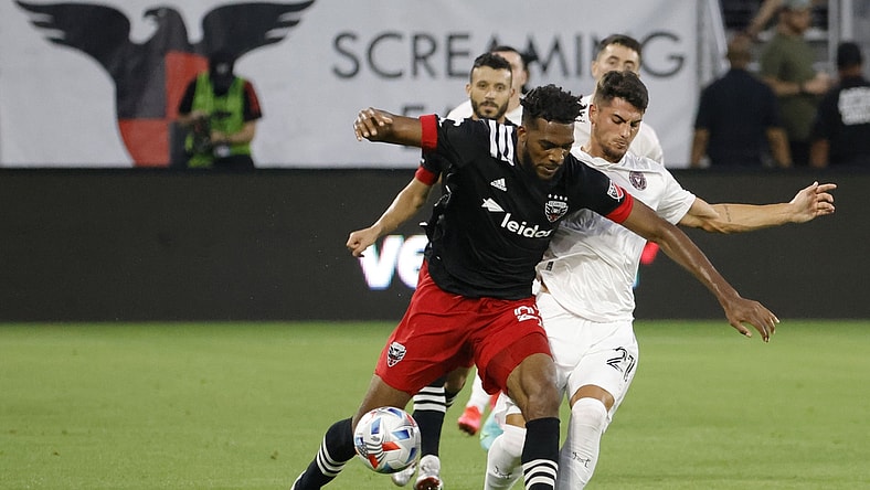 Jun 19, 2021; Washington, DC, Washington, DC, USA; D.C. United defender Donovan Pines (23) dribbles the ball as Inter Miami forward Julian Carranza (21) defends in the first half at Audi Field. Mandatory Credit: Geoff Burke-USA TODAY Sports