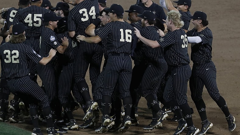 Jun 19, 2021; Omaha, Nebraska, USA;  Vanderbilt Commodores third baseman Jayson Gonzalez (99) celebrates after defeating the Arizona Wildcats  at TD Ameritrade Park. Mandatory Credit: Bruce Thorson-USA TODAY Sports