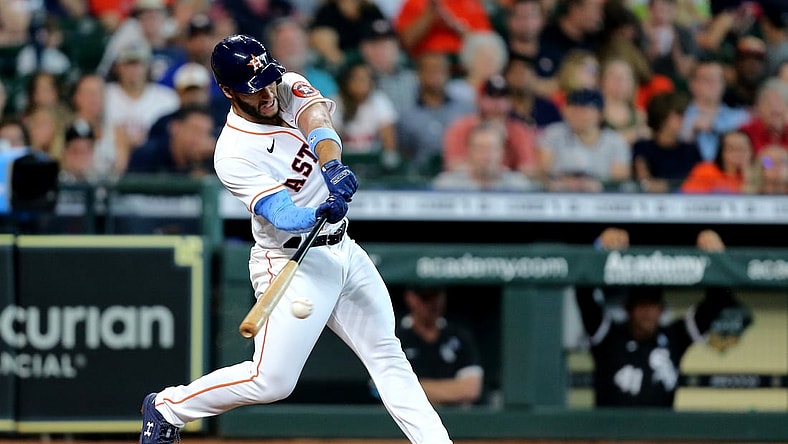 Jun 20, 2021; Houston, Texas, USA; Houston Astros third baseman Abraham Toro (13) hits a single to right field against the Chicago White Sox during the third inning at Minute Maid Park. Mandatory Credit: Erik Williams-USA TODAY Sports