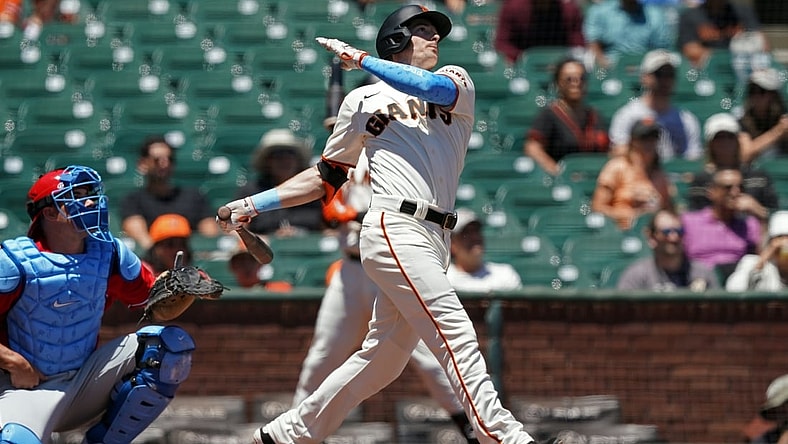 Jun 20, 2021; San Francisco, California, USA; San Francisco Giants right fielder Mike Yastrzemski (5) hits a home run during the first inning against the Philadelphia Phillies at Oracle Park. Mandatory Credit: Darren Yamashita-USA TODAY Sports