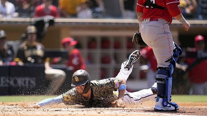 Jun 20, 2021; San Diego, California, USA;  San Diego Padres right fielder Wil Myers (5) scores a run against the Cincinnati Reds in the third inning at Petco Park. Mandatory Credit: Ray Acevedo-USA TODAY Sports