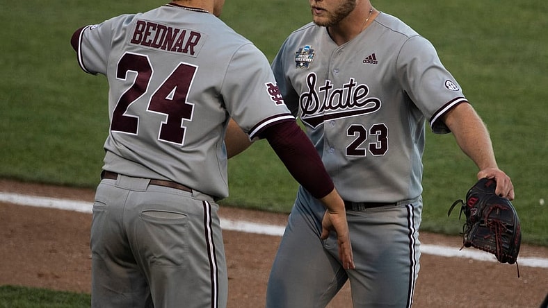 Mississippi St. pitcher Will Bednar (24) hugs relief pitcher Landon Sims (23) after Sims replaced Bednar in the seventh inning against Texas during game 4 in the NCAA Men   s College World Series at TD Ameritrade Park Sunday, June 20, 2021 in Omaha, Neb.

Nas Miss St Texas 028