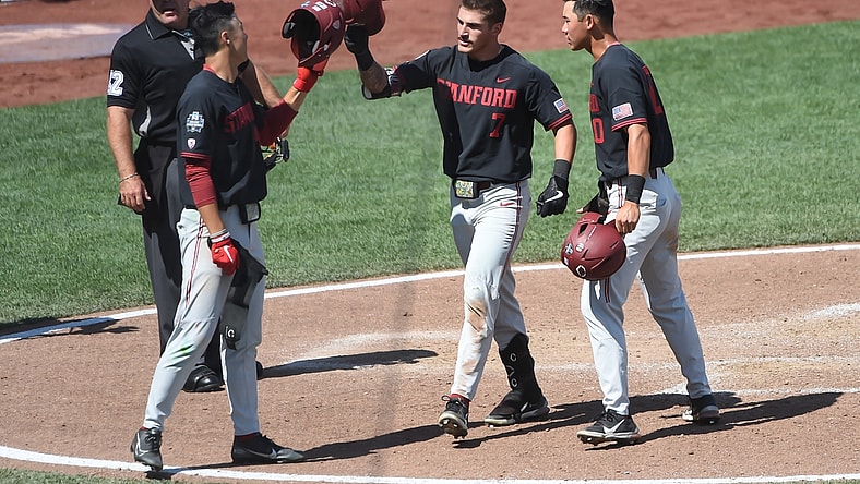 Jun 21, 2021; Omaha, Nebraska, USA;  Stanford Cardinal outfielder Brock Jones (7) celebrates a home run with outfielder Eddie Park (14) and infielder Adam Crampton (10) against the Arizona Wildcats in the seventh inning at TD Ameritrade Park. Mandatory Credit: Steven Branscombe-USA TODAY Sports