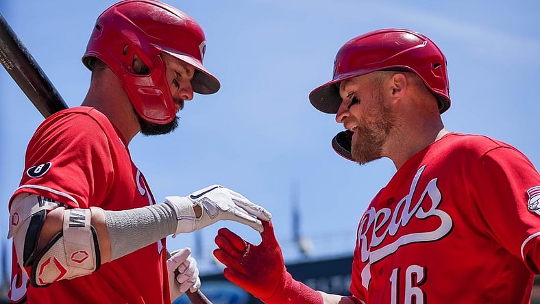 Jun 22, 2021; Minneapolis, Minnesota, USA; Cincinnati Reds catcher Tucker Barnhart (16) celebrates his home run with designated hitter Jesse Winker (33) against the Minnesota Twins in the third inning at Target Field. Mandatory Credit: Brad Rempel-USA TODAY Sports