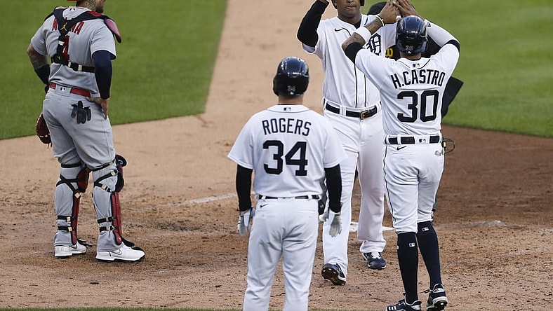 Jun 22, 2021; Detroit, Michigan, USA; Detroit Tigers second baseman Jonathan Schoop (7) celebrates with shortstop Harold Castro (30) and catcher Jake Rogers (34) after hitting a three run home run during the fourth inning against the St. Louis Cardinals at Comerica Park. Mandatory Credit: Raj Mehta-USA TODAY Sports