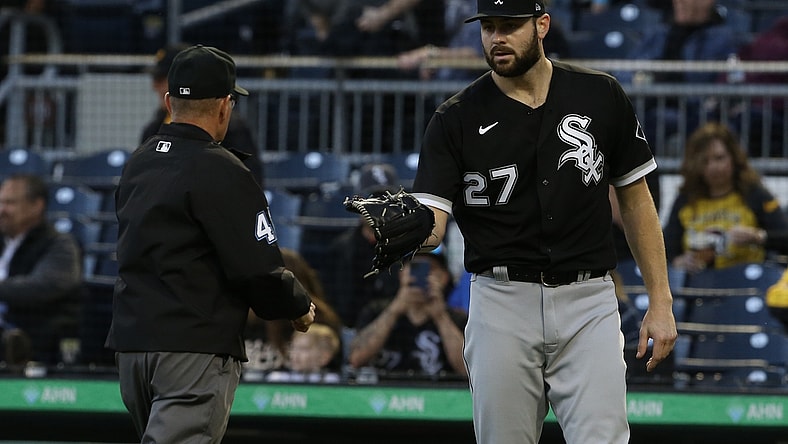Jun 22, 2021; Pittsburgh, Pennsylvania, USA;  Umpire Jerry Meals (41) checks the glove of Chicago White Sox starting pitcher Lucas Giolito (27) for foreign substances after Giolito pitched the fifth inning against the Pittsburgh Pirates at PNC Park. Mandatory Credit: Charles LeClaire-USA TODAY Sports