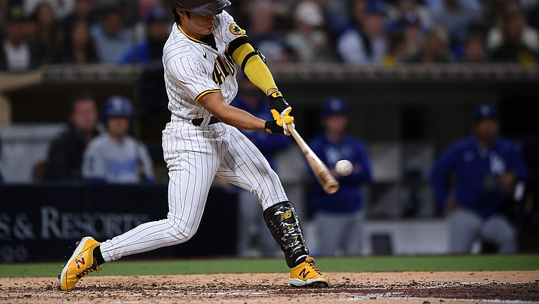 Jun 22, 2021; San Diego, California, USA; San Diego Padres pinch hitter Ha-seong Kim (7) hits a home run against the Los Angeles Dodgers during the fifth inning at Petco Park. Mandatory Credit: Orlando Ramirez-USA TODAY Sports