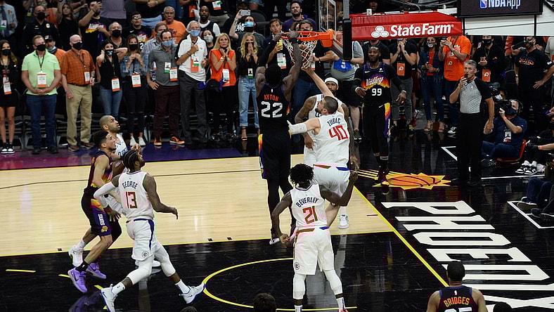 Jun 22, 2021; Phoenix, Arizona, USA; Phoenix Suns center Deandre Ayton (22) dunks over LA Clippers center Ivica Zubac (40) in the final second during the second half of game two of the Western Conference Finals for the 2021 NBA Playoffs at Phoenix Suns Arena. Mandatory Credit: Joe Camporeale-USA TODAY Sports