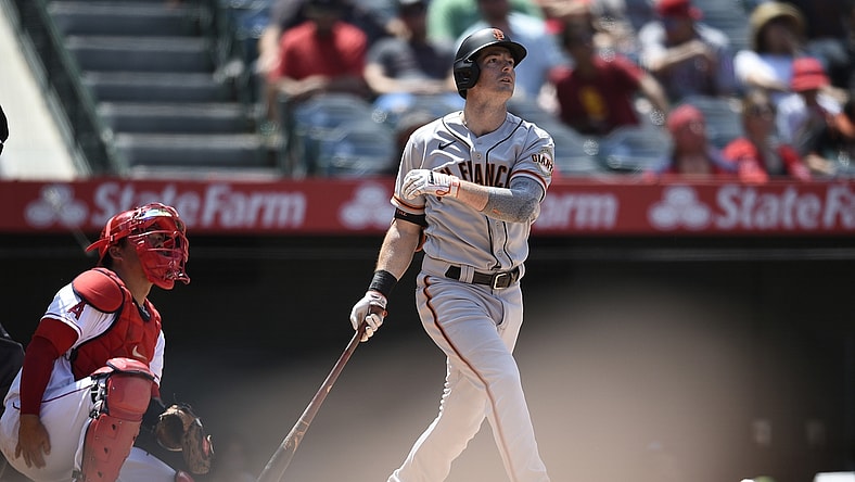 Jun 23, 2021; Anaheim, California, USA; San Francisco Giants right fielder Mike Yastrzemski (5) follows through on a swing for a solo home run during the fifth inning against the Los Angeles Angels at Angel Stadium. Mandatory Credit: Kelvin Kuo-USA TODAY Sports