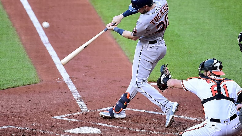 Jun 23, 2021; Baltimore, Maryland, USA; Houston Astros outfielder Kyle Tucker (30) hits an RBI single in the first inning against the Baltimore Orioles at Oriole Park at Camden Yards. Mandatory Credit: Evan Habeeb-USA TODAY Sports